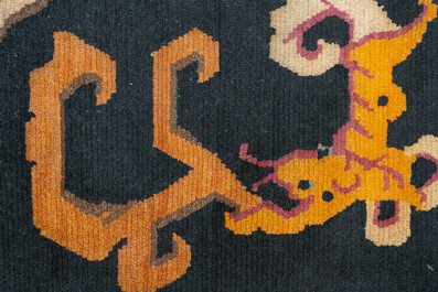 Two Tibetan woollen rugs with floral design, 19th C.