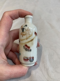 Two Chinese famille rose 'erotic' snuff bottles and a leaf-shaped saucer, 19th C.