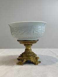 A Chinese white-glazed 'anhua' 'chilong' bowl on gilt bronze stand, 18/19th C.