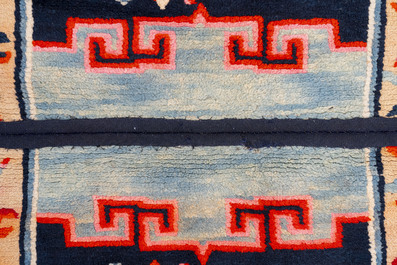 Two Tibetan saddle rugs and three small rugs, 19th C.