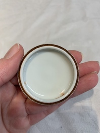 A Chinese famille rose seal paste box and a covered jarlet, a miniature wucai vase and a blue and white snuff bottle, Kangxi mark, 19/20th C.