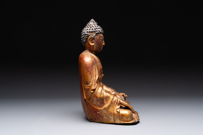 A Chinese gilt-lacquered wooden sculpture of Buddha, Ming