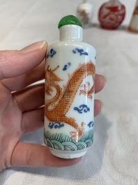 Three Chinese porcelain snuff bottles and a red Peking glass snuff bottle, Daoguang and Tongzhi mark, 19th C.