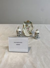 Two Chinese famille rose 'erotic' snuff bottles and a leaf-shaped saucer, 19th C.