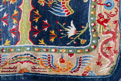 Two Tibetan saddle rugs with dragons and phoenixes, 19th C.