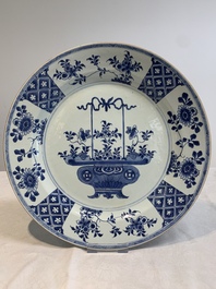 A pair of Chinese blue and white 'flower basket' dishes, Yongzheng