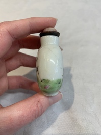A pair of Chinese blue, white and copper-red 'mythical beasts' and a famille rose 'grasshopper' snuff bottle, Yongzheng and Daoguang mark, 19th C.