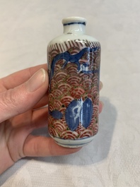 A pair of Chinese blue, white and copper-red 'mythical beasts' and a famille rose 'grasshopper' snuff bottle, Yongzheng and Daoguang mark, 19th C.