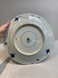 A Chinese blue and white armorial dish with the arms of Pelgrom for the Dutch market, Kangxi
