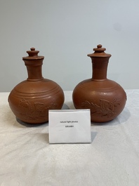 A pair of Yixing-style 'phoenix' bottle vases and covers, possibly England, 18th C.