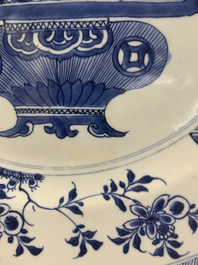 A pair of Chinese blue and white 'flower basket' dishes, Yongzheng