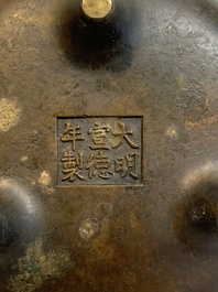 A Chinese bronze tripod censer with wooden cover and stand, Xuande mark, 18/19th C.