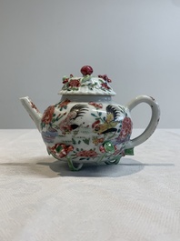 A Chinese famille rose 'rooster' teapot with applied floral design, two cups and a saucer, Yongzheng/Qianlong