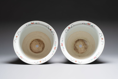 A pair of large Chinese famille rose 'dragon and phoenix' jardini&egrave;res and stands, 20th C.