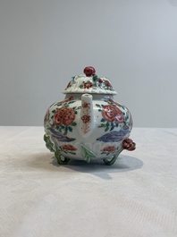 A Chinese famille rose 'rooster' teapot with applied floral design, two cups and a saucer, Yongzheng/Qianlong