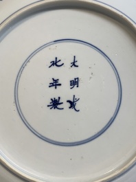 A Chinese blue and white 'heightened medallion' dish and a 'hunting' dish, Chenghua mark, Kangxi/Yongzheng