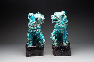 A pair of Chinese turquoise-and-aubergine-glazed Buddhist lions, probably Swatow kilns, 19th C.