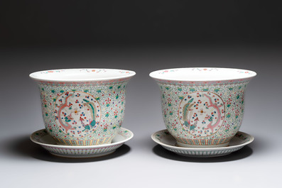 A pair of large Chinese famille rose 'dragon and phoenix' jardini&egrave;res and stands, 20th C.