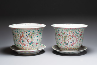 A pair of large Chinese famille rose 'dragon and phoenix' jardini&egrave;res and stands, 20th C.