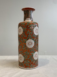 A Chinese famille verte coral-red-ground rouleau vase with flower scrolls, Kangxi