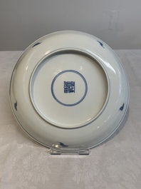 A pair of Chinese blue and white 'Eight Immortals' plates, Kangxi mark, 19th C.