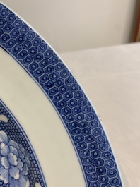 A Chinese blue and white armorial 'Marchant and Gallart accoll&eacute;' dish for the Dutch market, Qianlong