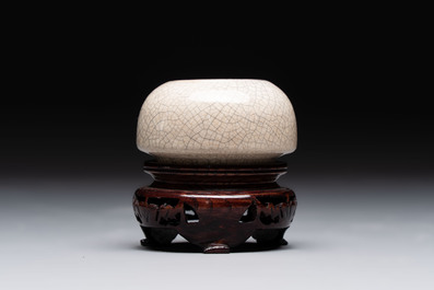Two Chinese monochrome vases and a water pot on wooden stand, 19/20th C.