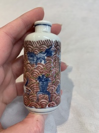 A pair of Chinese blue, white and copper-red 'mythical beasts' and a famille rose 'grasshopper' snuff bottle, Yongzheng and Daoguang mark, 19th C.
