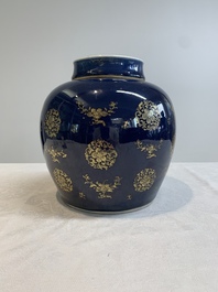 A Chinese gilt-decorated blue-ground jar and cover with floral design, Qianlong