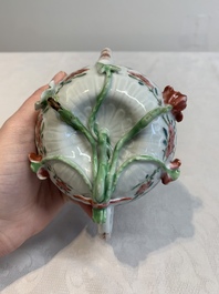 A Chinese famille rose 'rooster' teapot with applied floral design, two cups and a saucer, Yongzheng/Qianlong