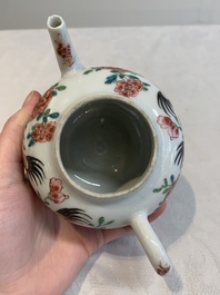 A Chinese famille rose 'rooster' teapot with applied floral design, two cups and a saucer, Yongzheng/Qianlong