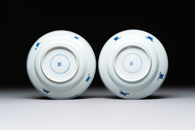 A pair of Chinese blue and white 'dragon' plates and a plate with narrative design, Yuzhen mark, Kangxi/Yongzheng