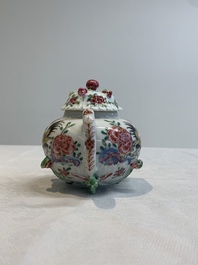 A Chinese famille rose 'rooster' teapot with applied floral design, two cups and a saucer, Yongzheng/Qianlong
