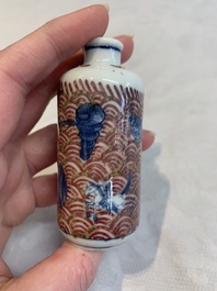 A pair of Chinese blue, white and copper-red 'mythical beasts' and a famille rose 'grasshopper' snuff bottle, Yongzheng and Daoguang mark, 19th C.