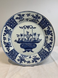 A pair of Chinese blue and white 'flower basket' dishes, Yongzheng
