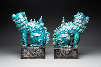 A pair of Chinese turquoise-and-aubergine-glazed Buddhist lions, probably Swatow kilns, 19th C.