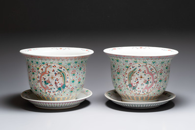 A pair of large Chinese famille rose 'dragon and phoenix' jardini&egrave;res and stands, 20th C.