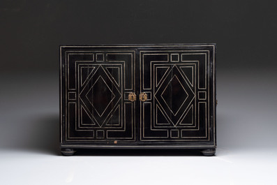 A fine ebony-veneered bone-inlaid cabinet, probably Italy, 19th C.