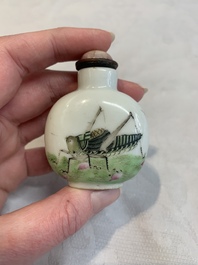 A pair of Chinese blue, white and copper-red 'mythical beasts' and a famille rose 'grasshopper' snuff bottle, Yongzheng and Daoguang mark, 19th C.