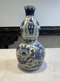 A Chinese blue and white 'flying horse' double gourd vase, Wanli