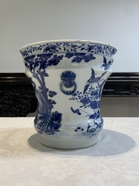 A pair of Chinese blue and white 'birds among flowering branches' jardini&egrave;res, 19th C.