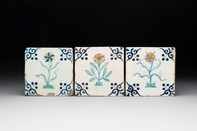 Five polychrome Dutch Delft 'flower' tiles, 17th C.