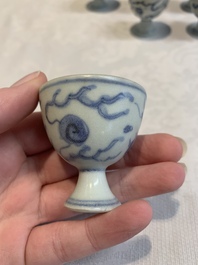 Six Chinese blue and white 'Hatcher cargo' stem cups with dragons, Transitional period