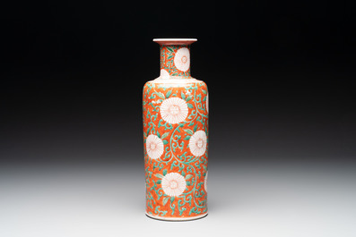 A Chinese famille verte coral-red-ground rouleau vase with flower scrolls, Kangxi