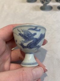 Six Chinese blue and white 'Hatcher cargo' stem cups with dragons, Transitional period