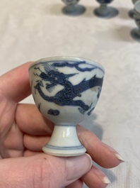 Six Chinese blue and white 'Hatcher cargo' stem cups with dragons, Transitional period