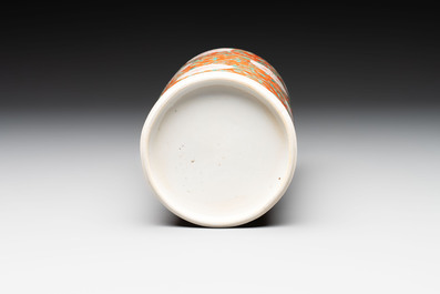 A Chinese famille verte coral-red-ground rouleau vase with flower scrolls, Kangxi
