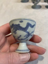 Six Chinese blue and white 'Hatcher cargo' stem cups with dragons, Transitional period