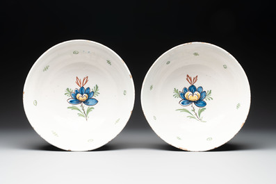 A pair of polychrome Dutch Delft 'duck hunt' bowls, 18th C.