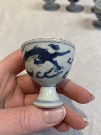 Six Chinese blue and white 'Hatcher cargo' stem cups with dragons, Transitional period